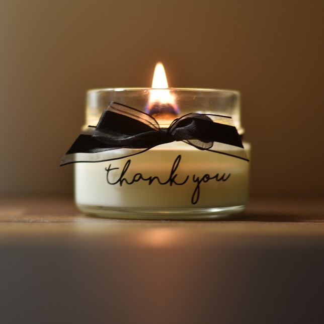 white and black candle holder